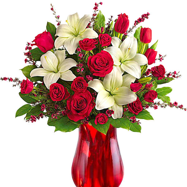 Red roses and white lilies in a red glass vase
