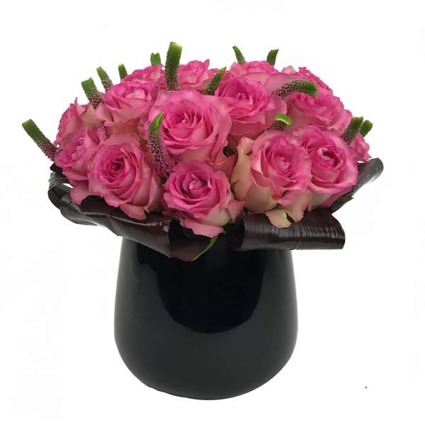 Pink rose bouquet in a black vase