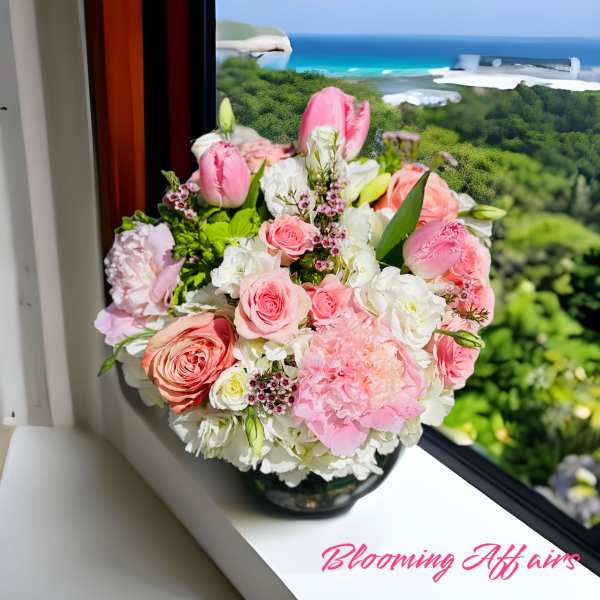 Pink and white bouquet in a glass vase