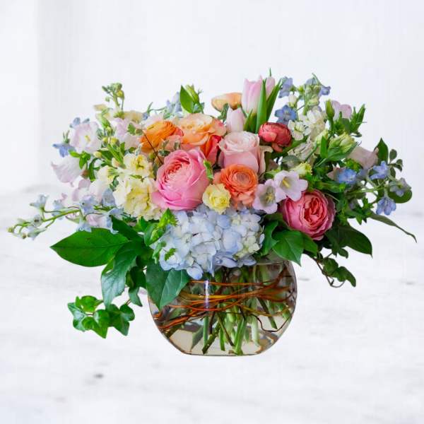 Mixed pastel bouquet in a clear glass vase