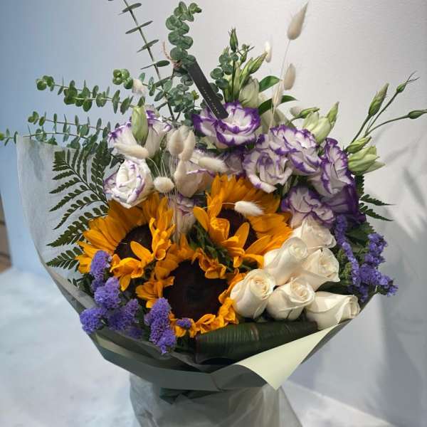 Bouquet with sunflowers, white roses, and purple-edged lisianthus