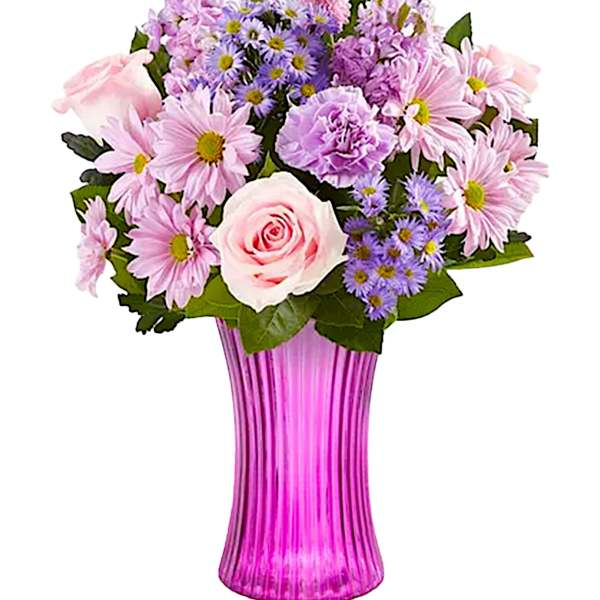 Pink and purple mixed bouquet in a tall ribbed vase