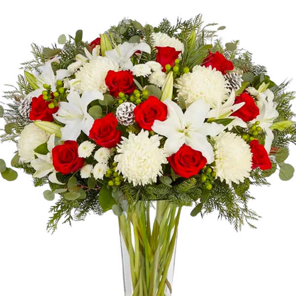 Red roses and white lilies in a clear glass vase