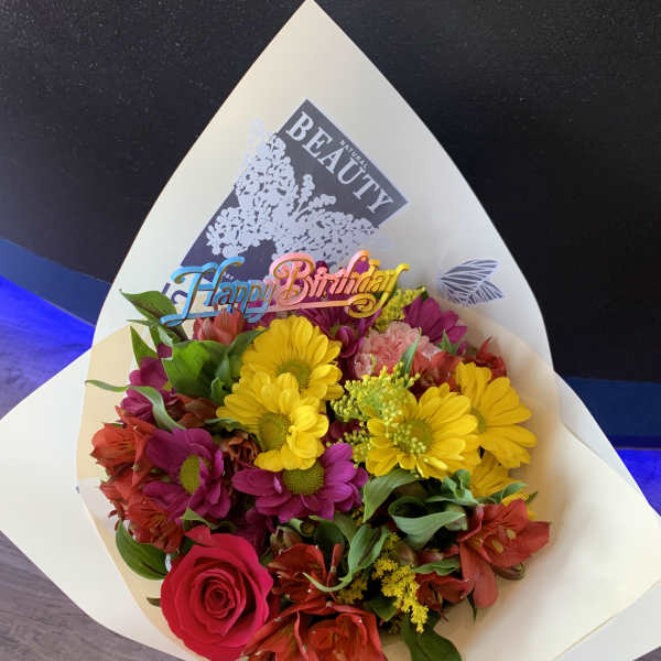 Mixed bouquet with a birthday topper in white wrap