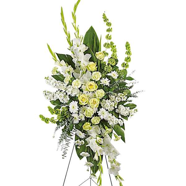 Tall white and pale yellow floral standing spray on an easel