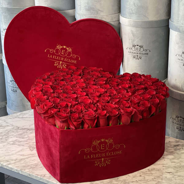 Heart-shaped box filled with red roses