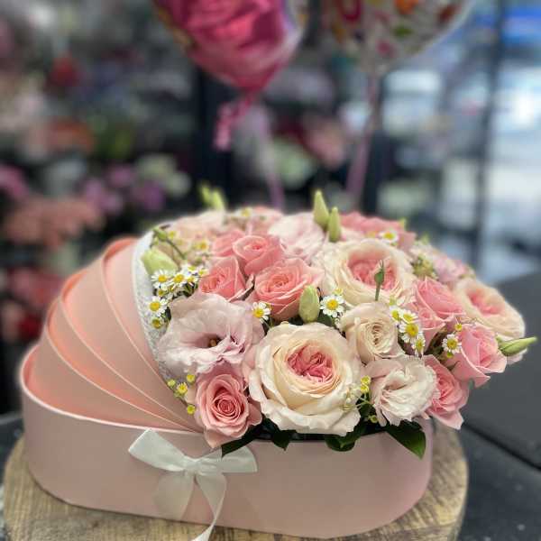 Pink and cream rose bouquet in a pastel hat box with a ribbon