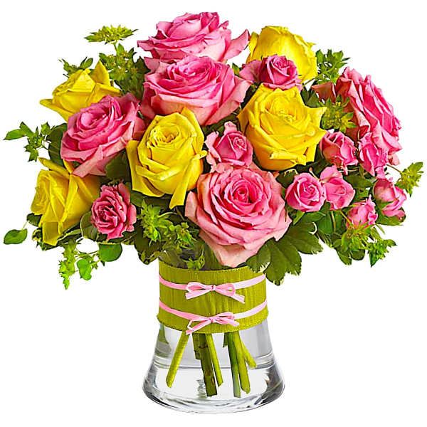 Pink and yellow roses in a clear glass vase with ribbon