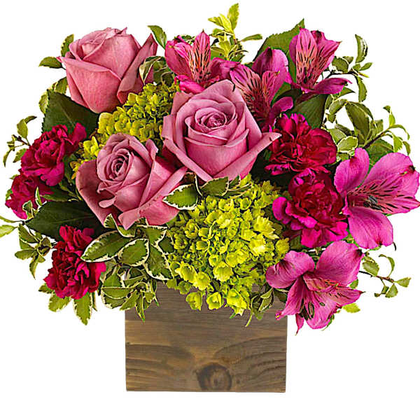 Pink roses and magenta alstroemeria in a wooden box