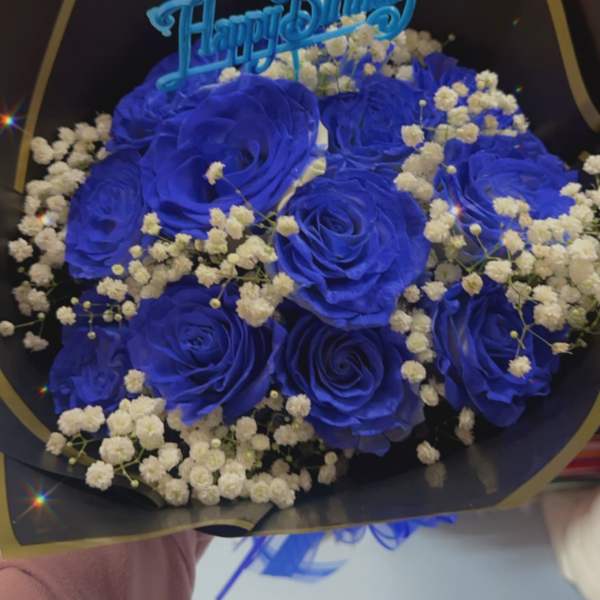 Blue rose bouquet with baby's breath and a Happy Birthday topper