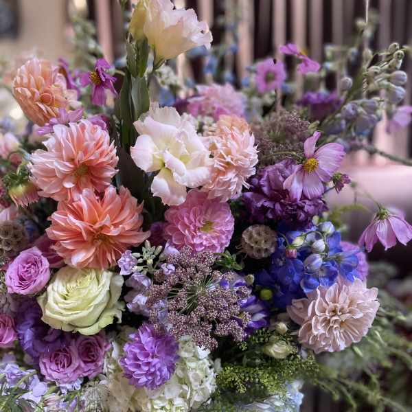 Mixed bouquet of pink, purple, blue, and white flowers