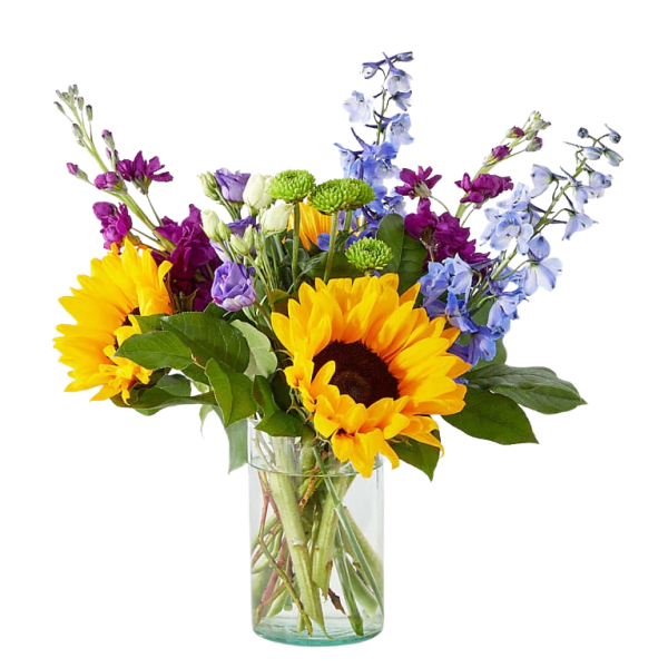 Bouquet of sunflowers, blue delphinium, and purple flowers in a glass vase