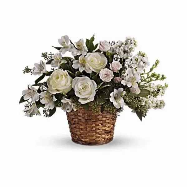 White floral arrangement in a woven basket