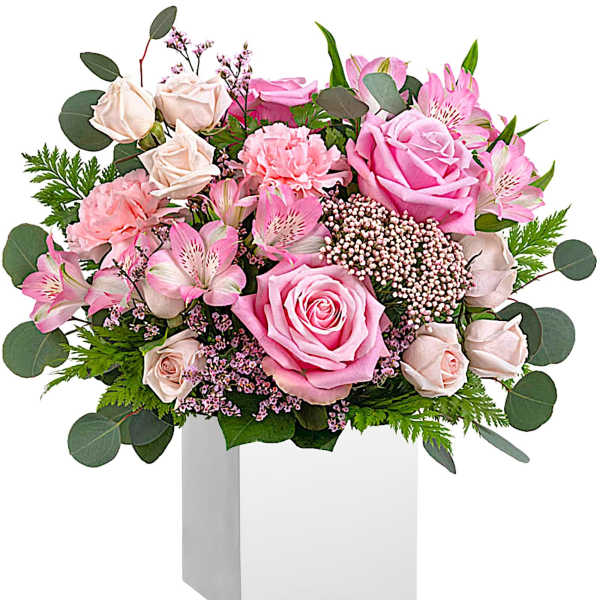 Pink roses and alstroemeria in a white box vase