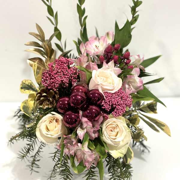 Pink and cream rose bouquet with burgundy ornaments and greenery