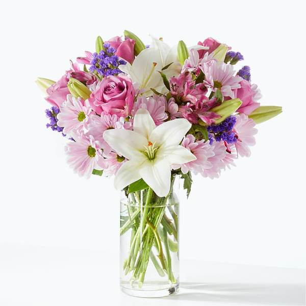 Pink and white mixed bouquet in a clear glass vase