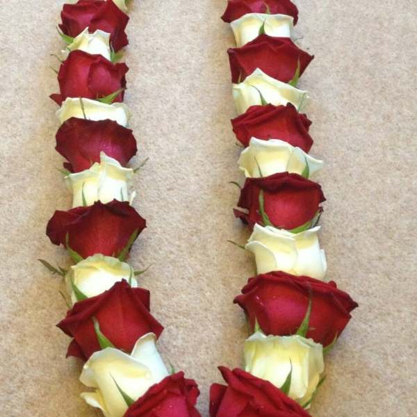 Heart-shaped arrangement of red and white roses