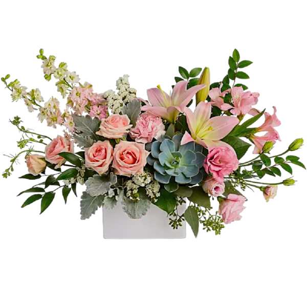 Pink roses and lilies arranged in a white rectangular vase