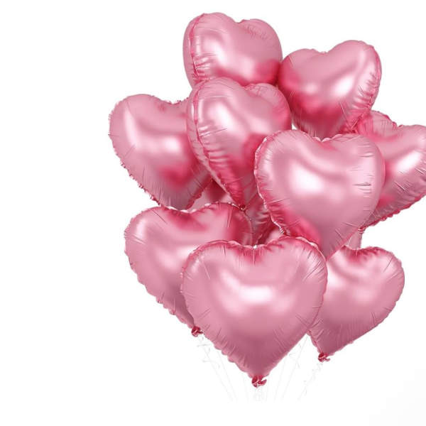 Cluster of pink heart-shaped balloons on white background