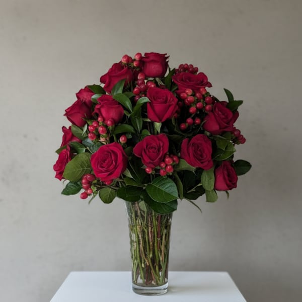 Bouquet of deep pink roses in a clear glass vase