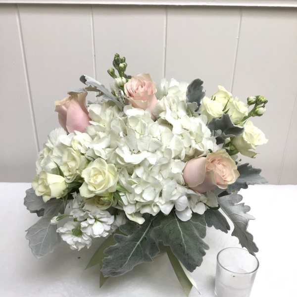 White hydrangea and pale pink rose bouquet with gray foliage