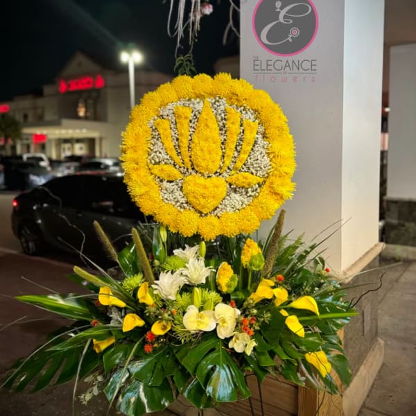 Large yellow floral standing display with orchids and calla lilies