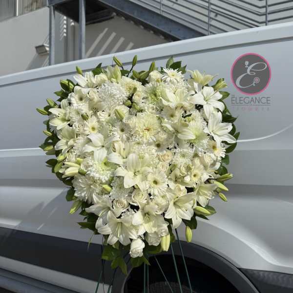 Large white floral spray with lilies, roses, and daisies