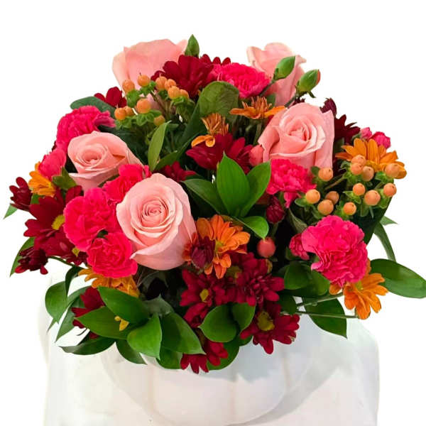 Bouquet of pink roses, carnations, and red-orange daisies