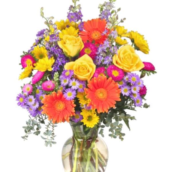 Colorful bouquet of mixed flowers in a glass vase