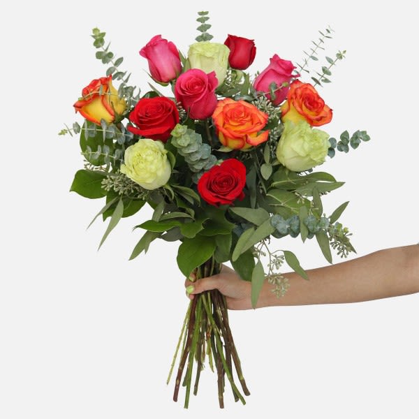 Handheld bouquet of multicolored roses with eucalyptus