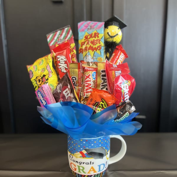 Candy bouquet in a graduation mug with blue wrap