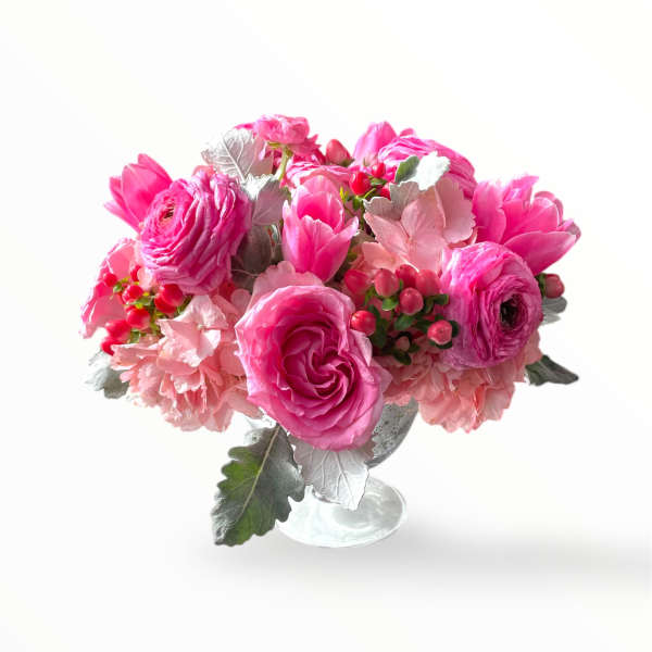 Pink floral arrangement in a clear glass vase