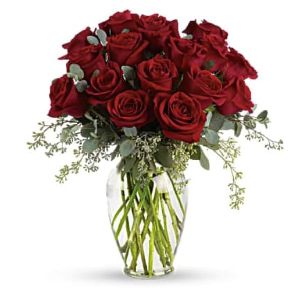 Bouquet of red roses in a clear glass vase