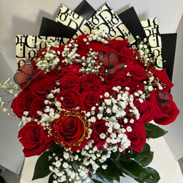 Bouquet of red roses with white baby's breath and butterfly accents