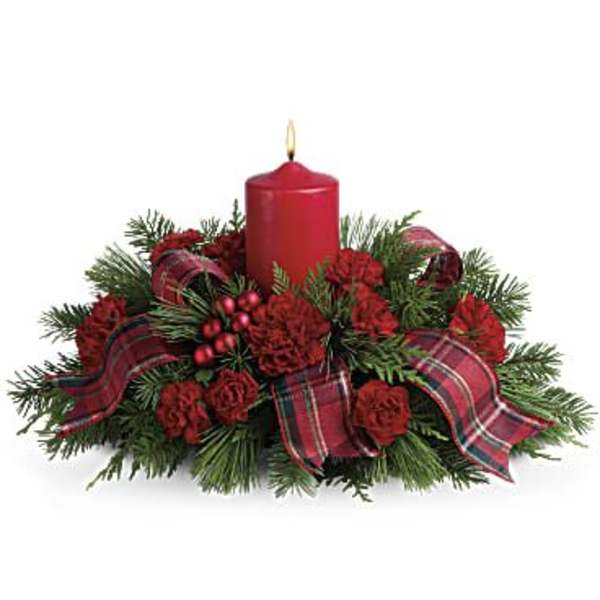 Red candle centerpiece with evergreen and plaid ribbon