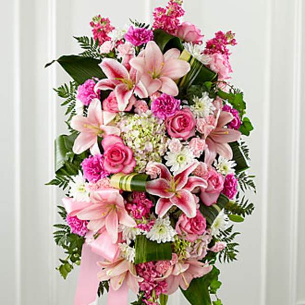 Pink and white floral standing spray with lilies and roses