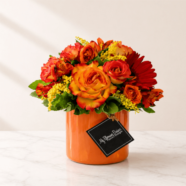 Orange and red rose bouquet in an orange vase