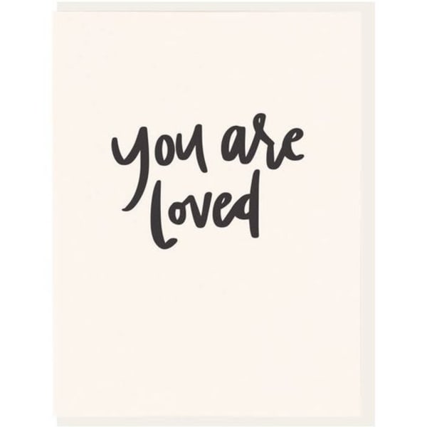 Card with the words "you are loved" in black script
