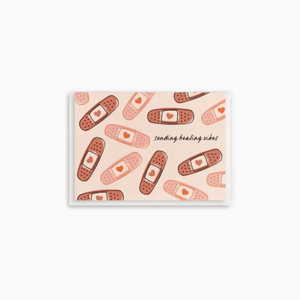 Greeting card with bandage illustrations and the words "sending healing vibes"
