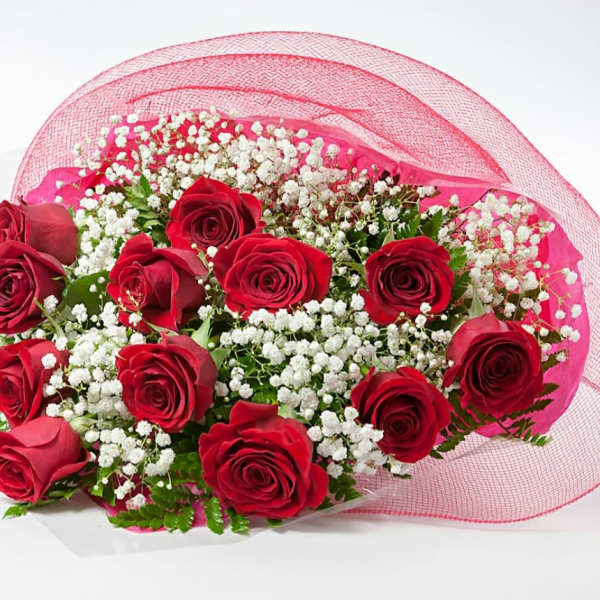 Bouquet of red roses with white baby's breath wrapped in pink mesh