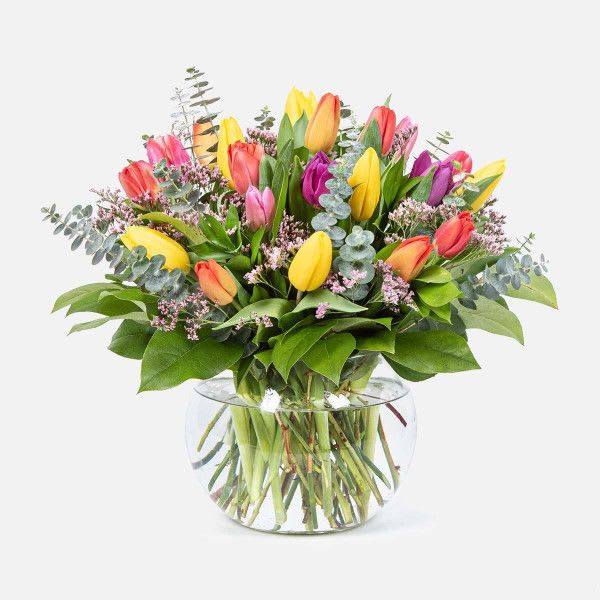 Mixed tulip bouquet in a clear glass vase