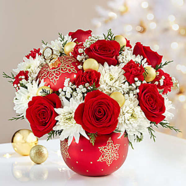 Red roses and white daisies in a red ornament vase