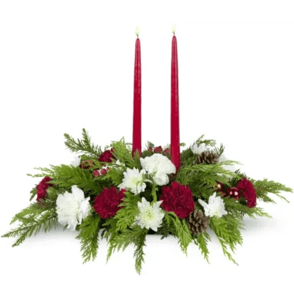 Christmas centerpiece with red candles and red and white flowers