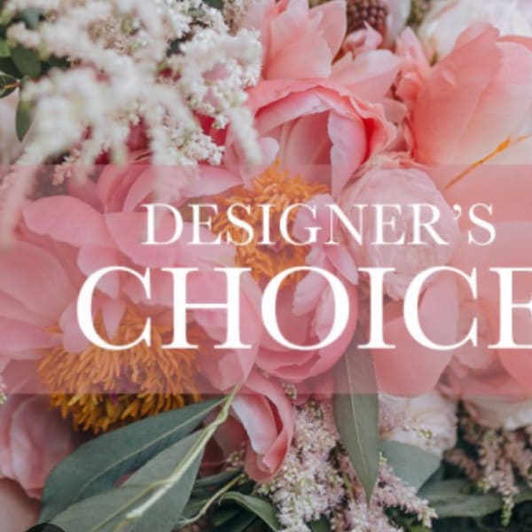 Pink floral arrangement with large blooms and white filler flowers