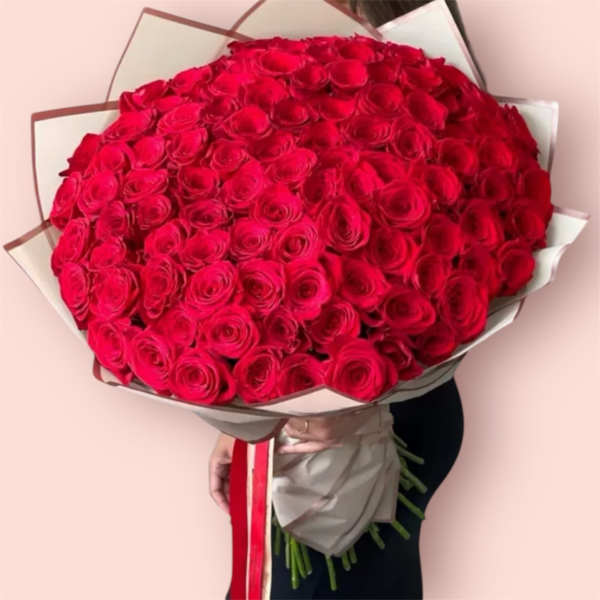 Large bouquet of red roses wrapped in paper