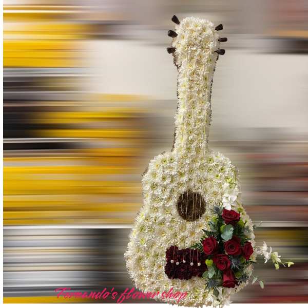 Tall guitar-shaped floral tribute in white with red roses and gold string accents