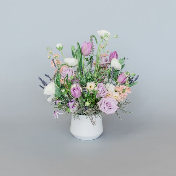 Lavender and white mixed bouquet in a white vase