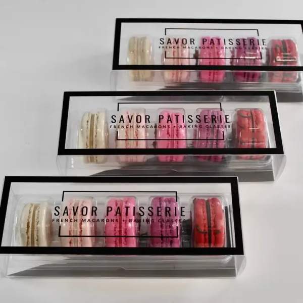 Boxes of assorted macarons in clear packaging