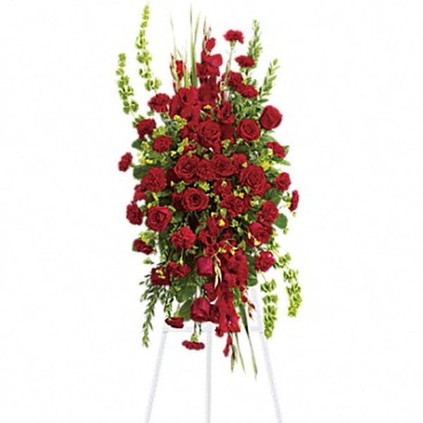 Tall red rose and carnation standing spray on a white easel