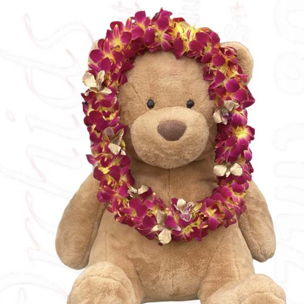 Teddy bear wearing a magenta flower lei